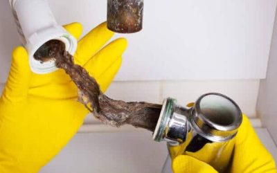 Funky Smell and Standing Water: How to Clear a Clogged Drain